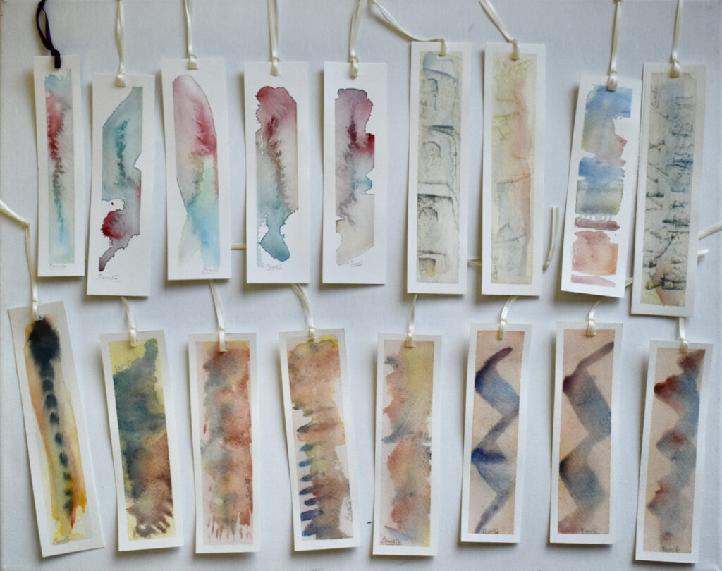 hand-painted bookmarks with tied ribbons