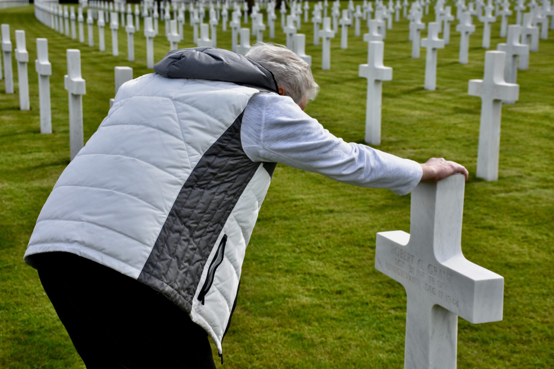 Bob touching his birth-father's cross for the first time